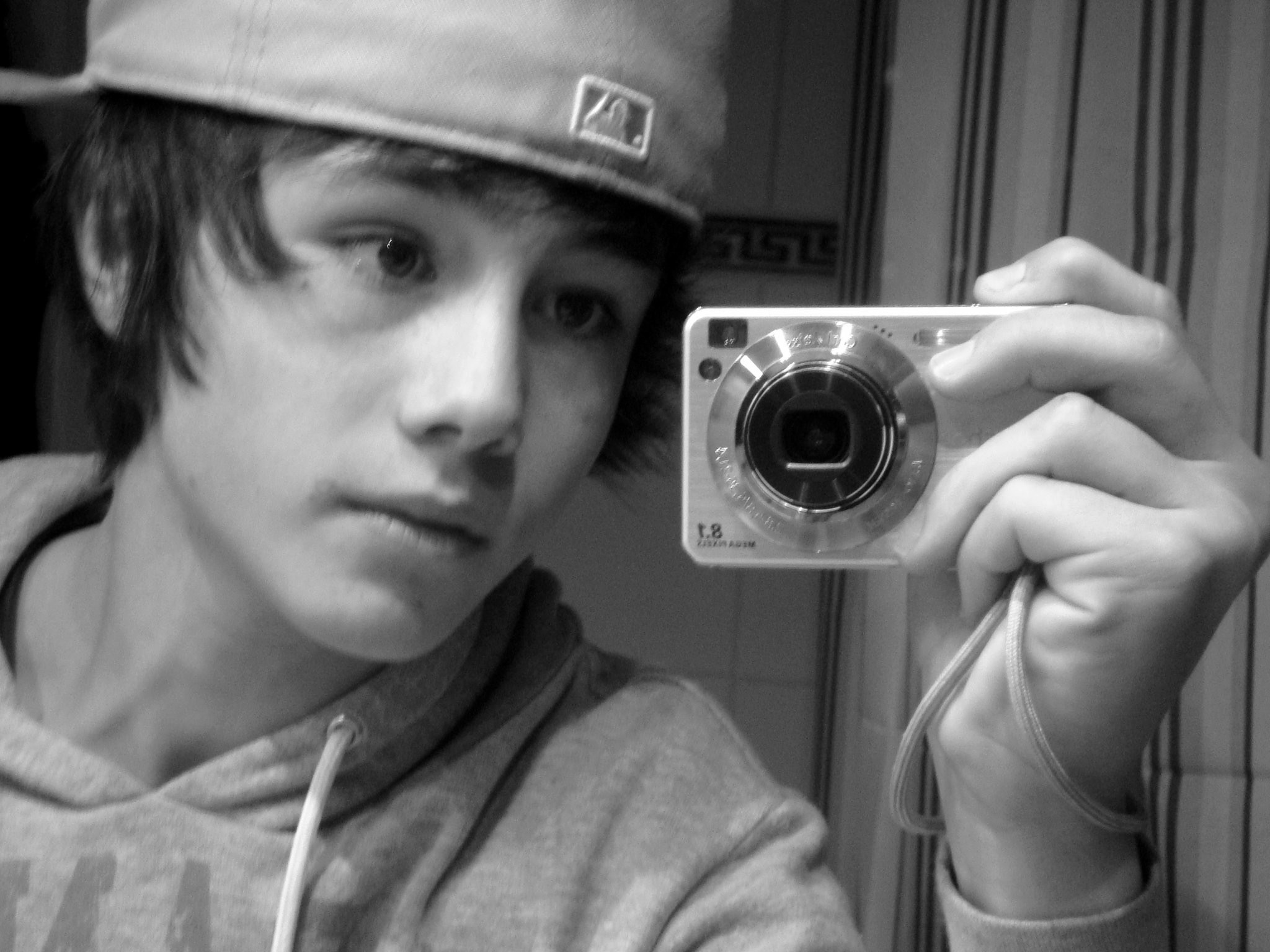 Young Enzo Carini holding a camera