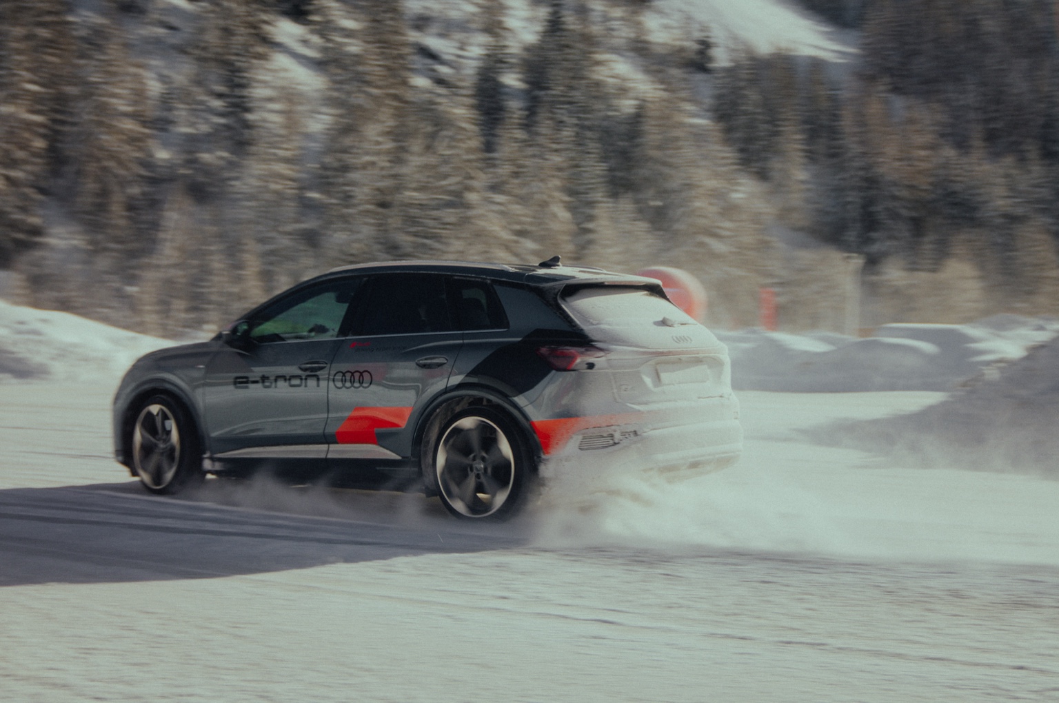 Audi e-tron driving across snow for Fusalp X Audi