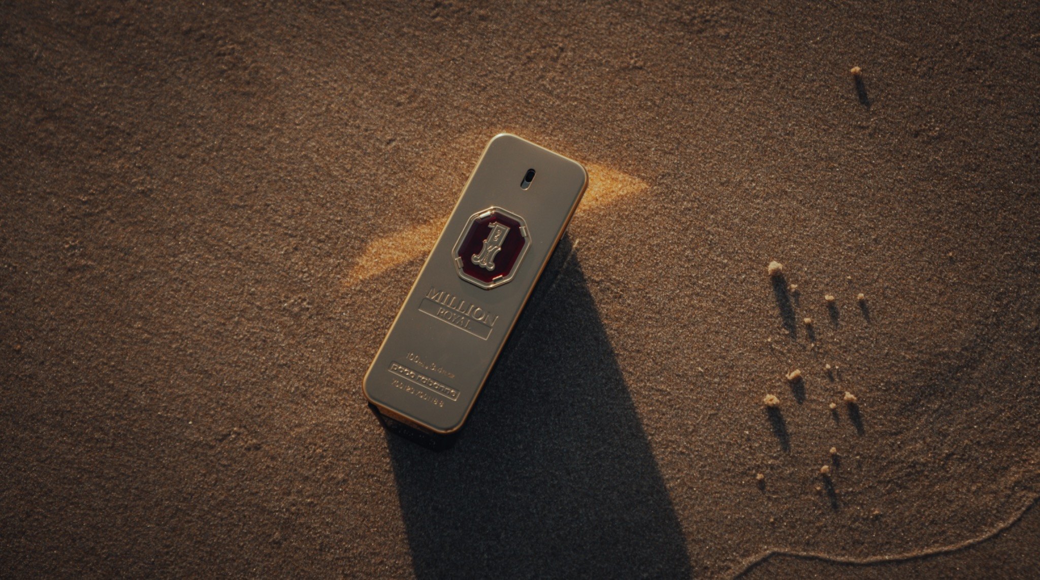 Paco Rabanne product detail on the sand