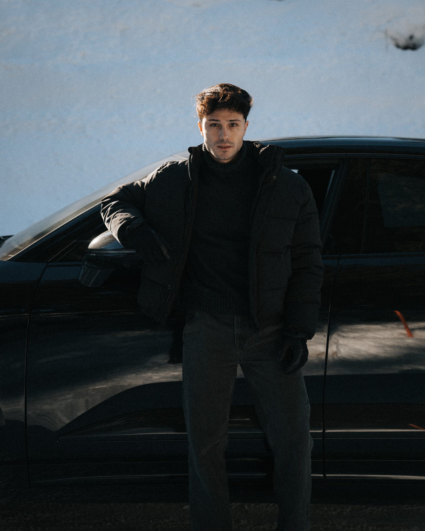 Porsche lifestyle portrait standing beside the car