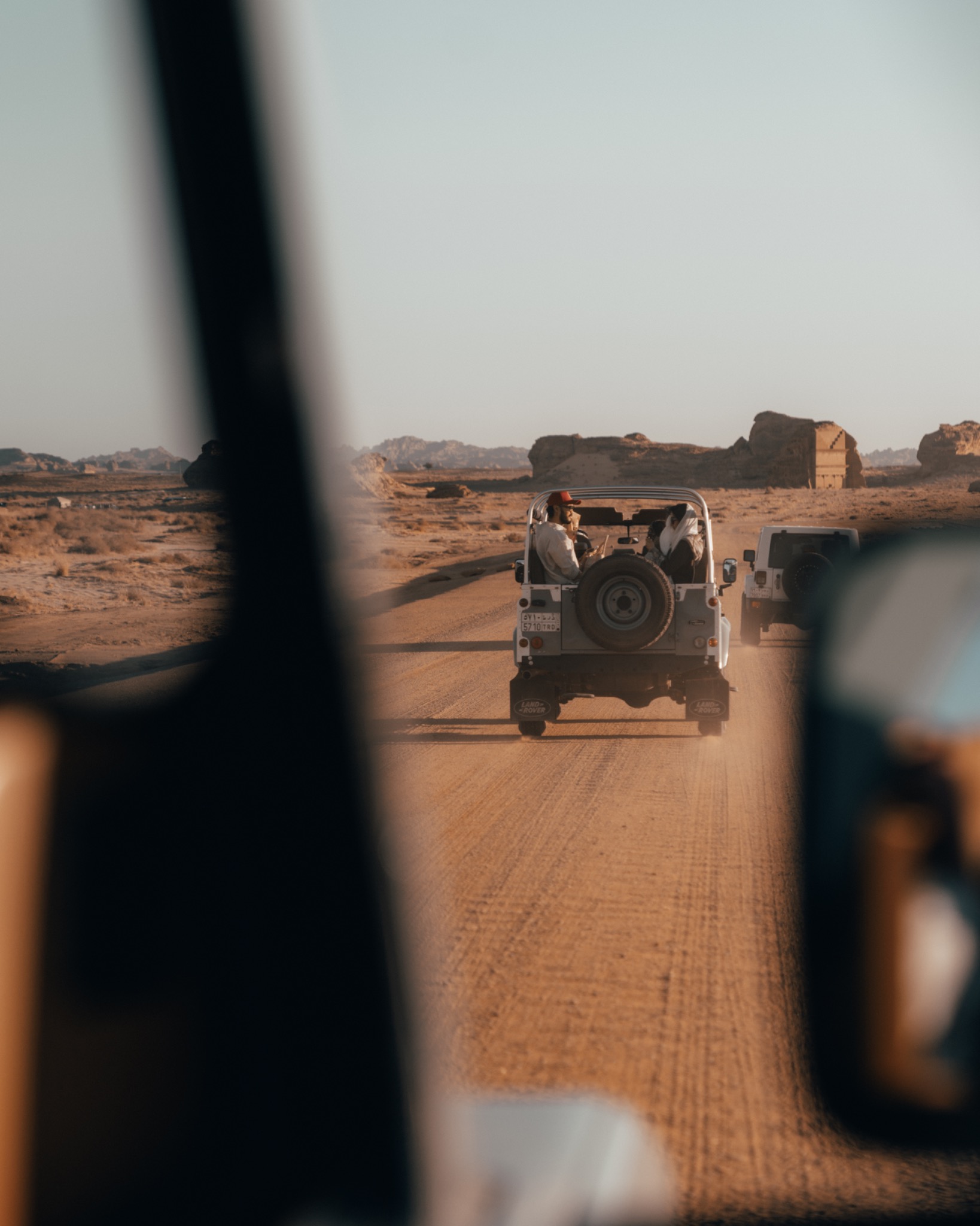 Visit Saudi jeep convoy driving through the desert